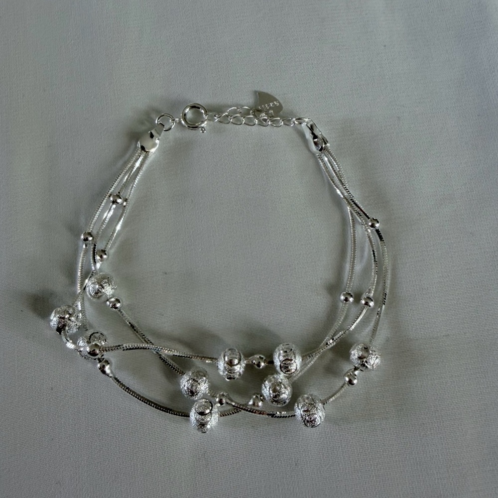 Triple Strand Ball Bead Bracelet Diamond Cut Design